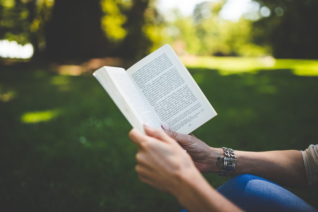 Book, woman, park — Gap Year Abroad Program for Meaningful Global Impact